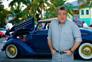 Marcel Forestieri as Jay Leno at a car show   