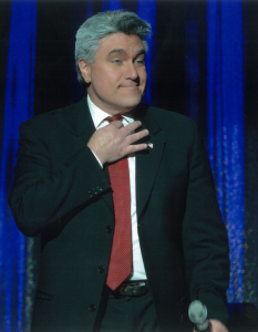 Marcel Forestieri as Jay Leno on stage   